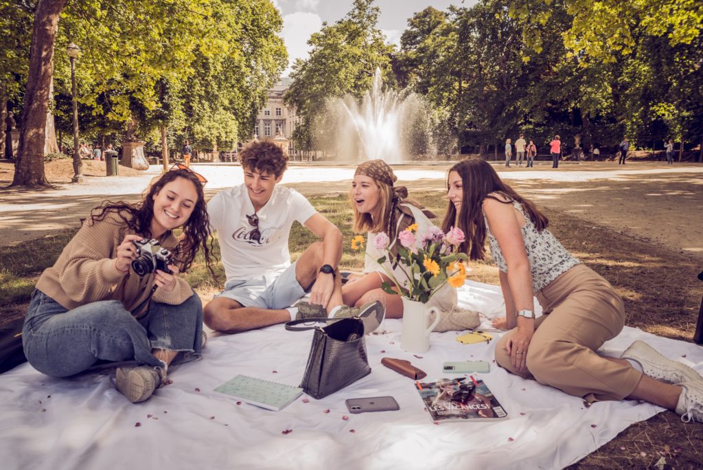 Group of Friends Sitting Outdoors